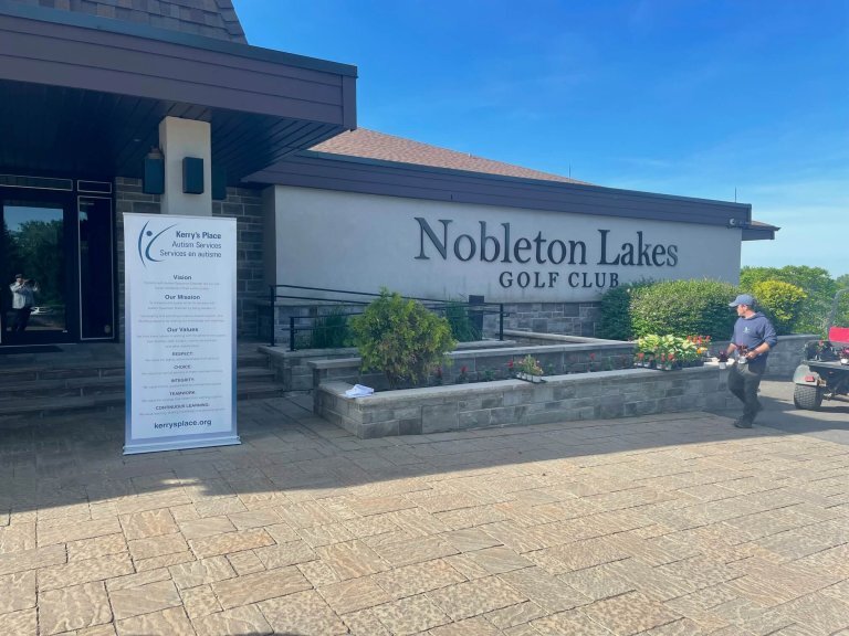 The Nobelton Lakes Golf Club building with a Kerry's Place banner at the entrance