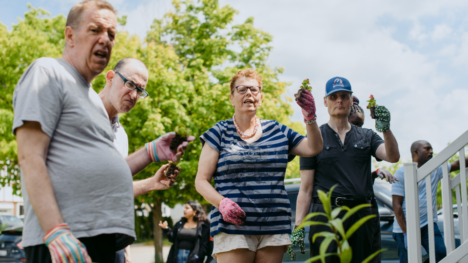Individuals at a Kerry's Place house enjoying gardening